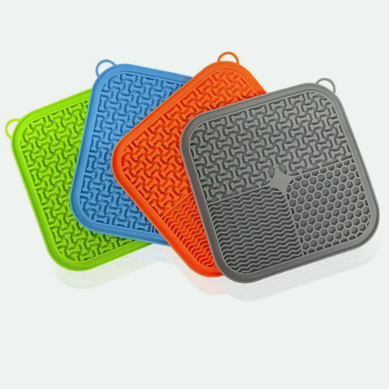 Four square silicone lick mats in different colours