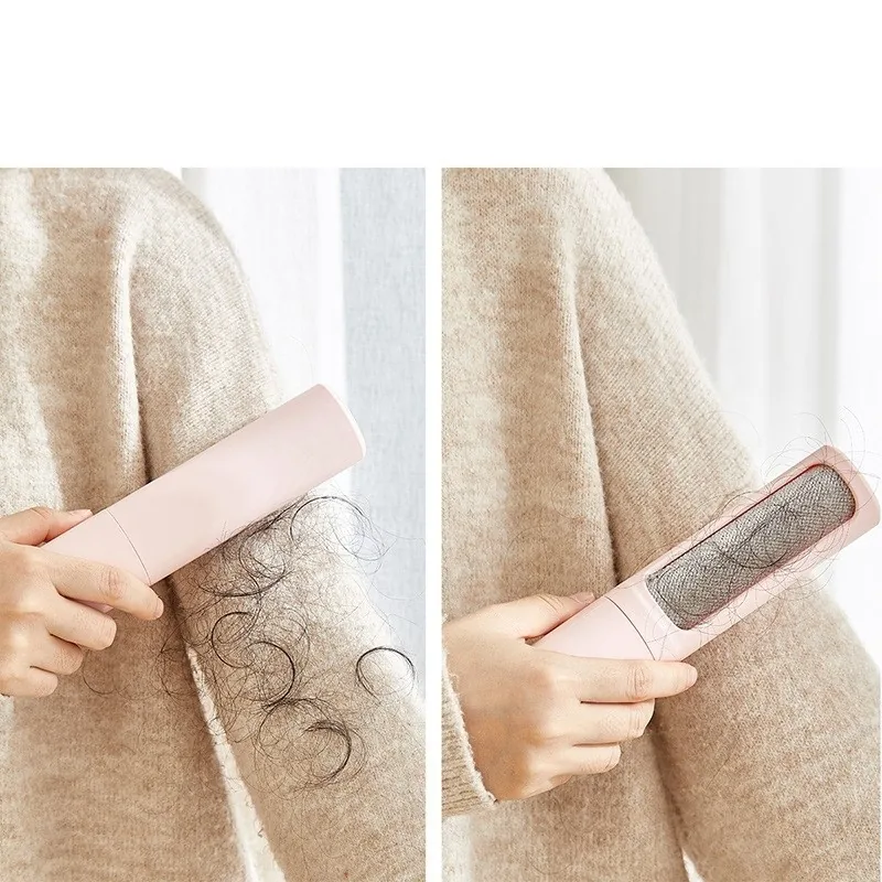 Hair remover being brushed over a knitted jumper